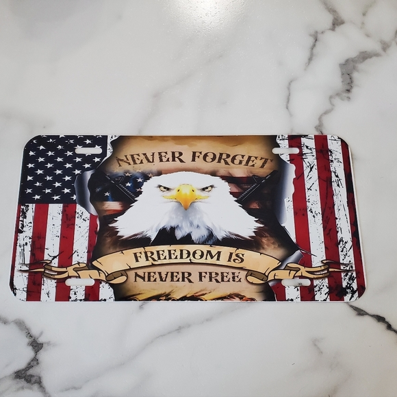 NEVER FORGET FREEDOM IS NEVER FREE License Plate - Picture 1 of 5